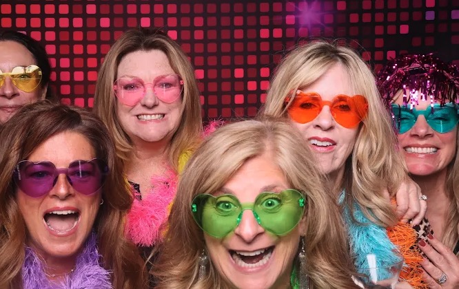 Group of friends with colorful sunglasses at party