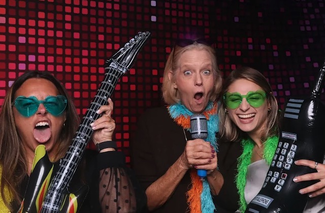 Guests with inflatable props at photo booth