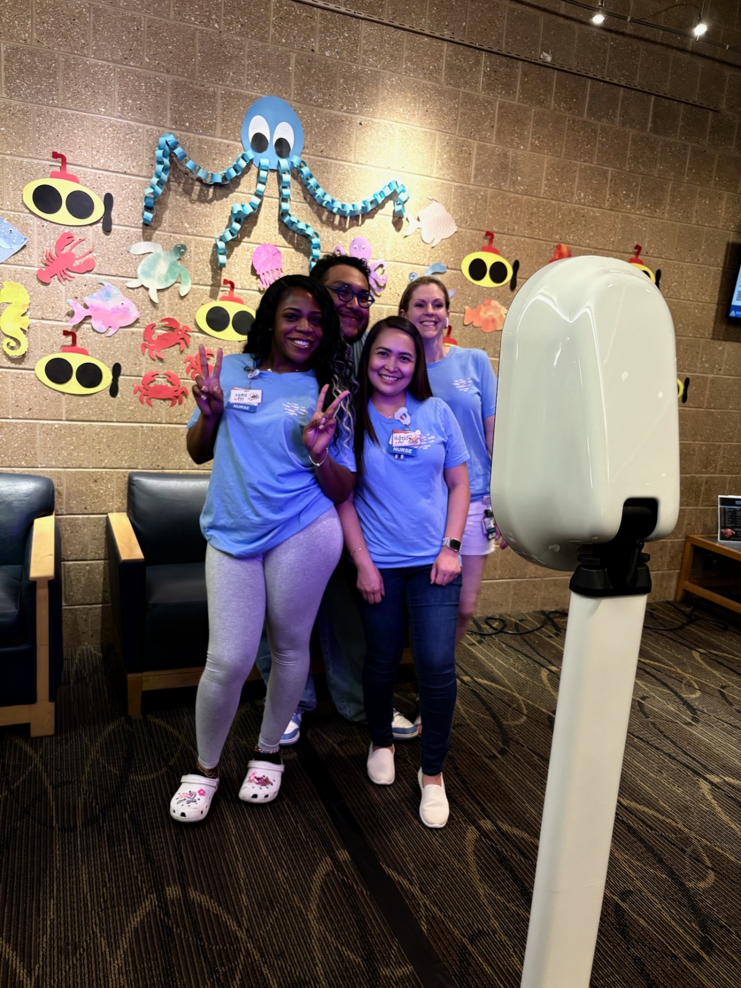 Group selfie at themed event booth